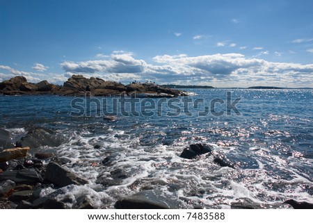 High tide fills a rocky tidal pool in landscape orientation