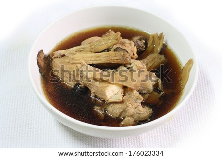 Chicken and herb soup in pot, Chinese food style.