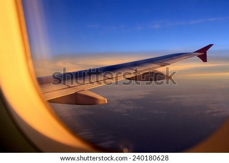 View from window of an airplane during sunset or sunrise