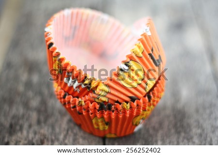 Cup cake cups with Halloween theme orange color.Selective focus, soft focus and shallow depth of fields