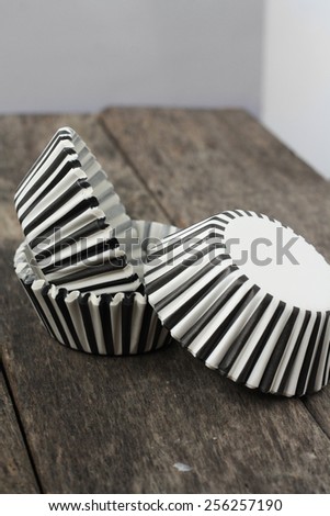 Stripe black and white muffin or cupcake cups. Selective focus, soft focus and shallow depth of fields