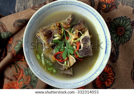 Sup Tulang - is the Malaysian version of bone broths. It is a traditional recipe, a humble but nutritious broth eaten for generations as comfort food. garnish with cili, lime and vegetables