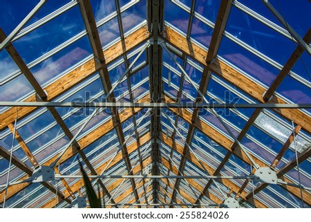 Steel construction with wood and glass, roof of the greenhouse