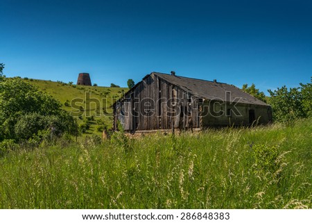 lonely old wooden barn in a field