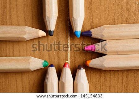 Pencils in cross formation closeup photo