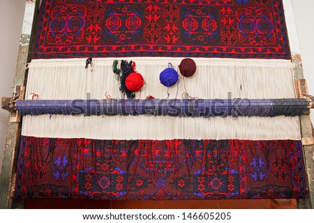 Artisan loom with handmade carpet