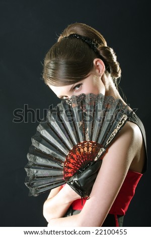 woman behind fan