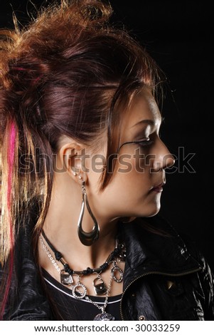 Woman in leather profile portrait over dark background