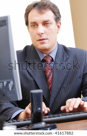 Businessman in formal wear working at computer and typing selective focus