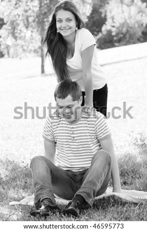 Happy couple in summer park black and white photo