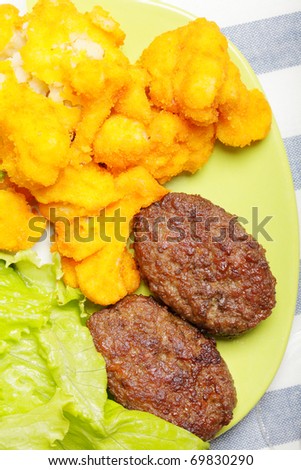 Meat cutlets with breaded cauliflower above view