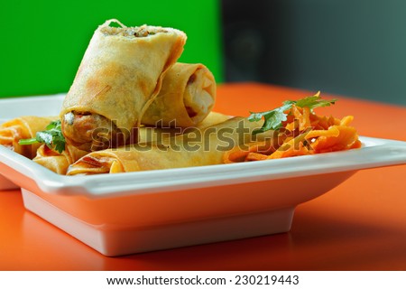 Spring rolls on a cafe table closeup photo