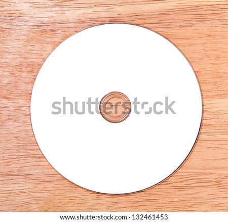Optical disk on a wooden background
