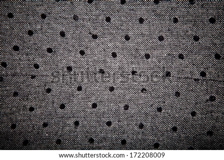 gray material with black circles background