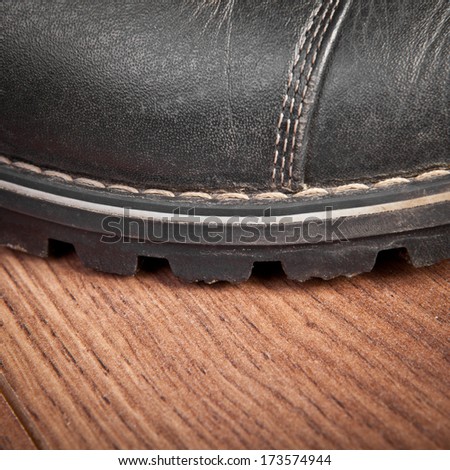 shoe sole on the wooden floor closeup