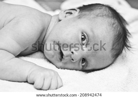 black and white portrait of a newborn baby close-up, shallow depth of field