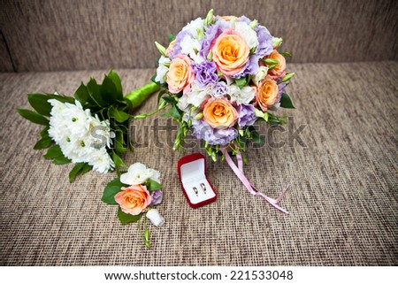 bridal bouquet of roses and wedding accessories, shallow depth of field