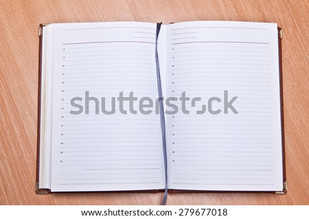 Open Address Book on a wooden background