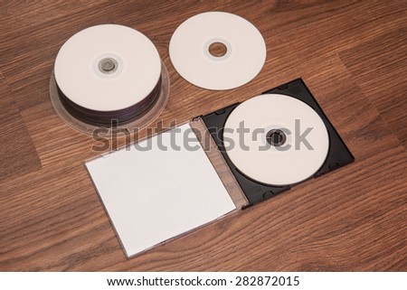 DVD discs for printing on a wooden background. layout