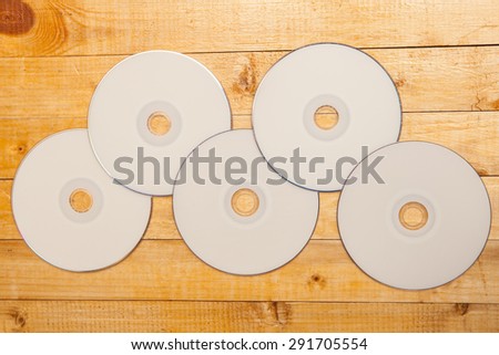 blank discs by printing on the wooden background
