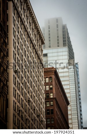 The architecture of Downtown Chicago, in the Theater District of the Loop, on a gloomy and cloudy day.