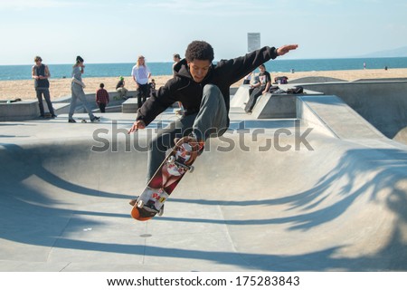 LOS ANGELES, CALIFORNIA - FEBRUARY 5, 2014: A local skateboarder practices his craft in the iconic skate park in Venice Beach.