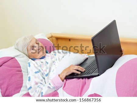 Elderly woman learns to use the  computer