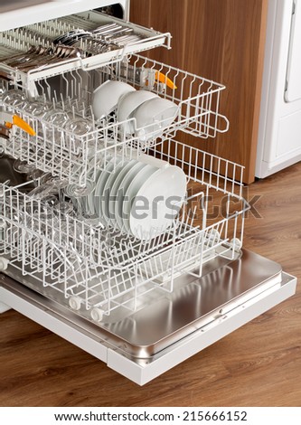 Picture of an opened dishwasher in the kitchen