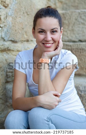 Picture of a beautiful woman sitting and smiling