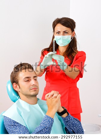 Scared dental patient receiving anesthesia injection