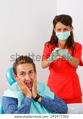 Scared dental patient receiving anesthesia injection