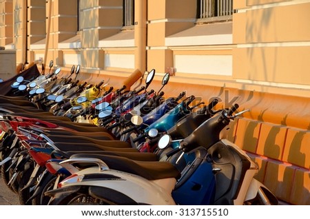 Ho Chi Minh City, Vietnam - March 7, 2015: rows of motorbikes parked outside a public building in Ho Chi Minh City.