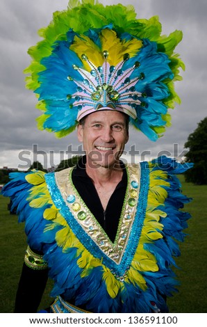 READING, ENGLAND - JUNE 4:  Unidentified men participate in the annual Reading Carnival on June 4, 2012 in Reading, England. The event has been held since 1977 and attracts hundreds of participants.