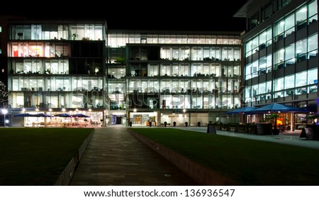Empty office building at night external view