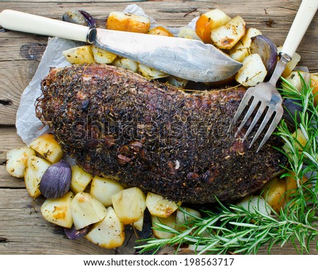 Roast Pork shoulder with Potatoes and herbs