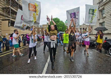LONDON - JUNE 28: People take part in London\'s Gay Pride, 2014 Worldpride on June 28, 2014 in London, UK, estimated 25,000 people took part in the march, Parade to support gay rights.