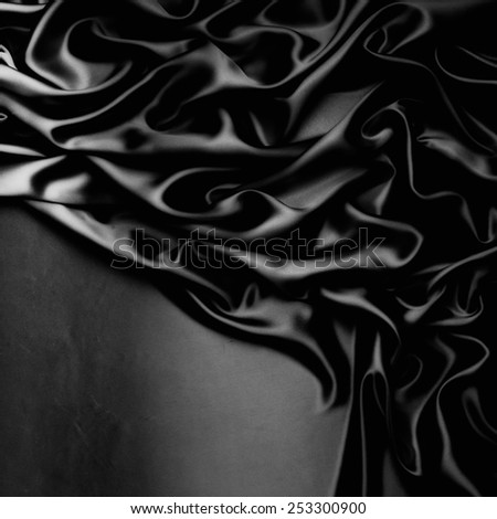 abstract background luxury cloth or liquid wave or wavy folds of grunge black silk texture satin velvet material or luxurious