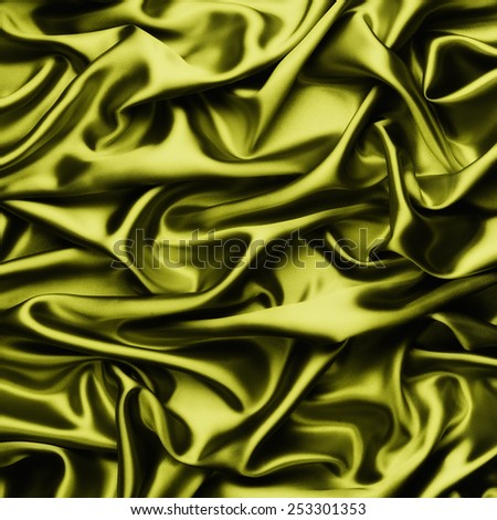 abstract background luxury cloth or liquid wave or wavy folds of grunge metalic yellow silk texture satin velvet material or luxurious