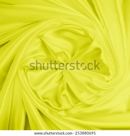 abstract background luxury cloth or liquid wave or wavy folds of grunge metalic yellow silk texture satin velvet material or luxurious