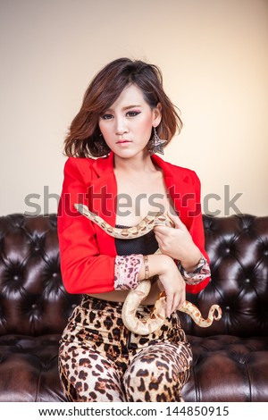 Red Suit Woman with  Boa Constrictor Snake