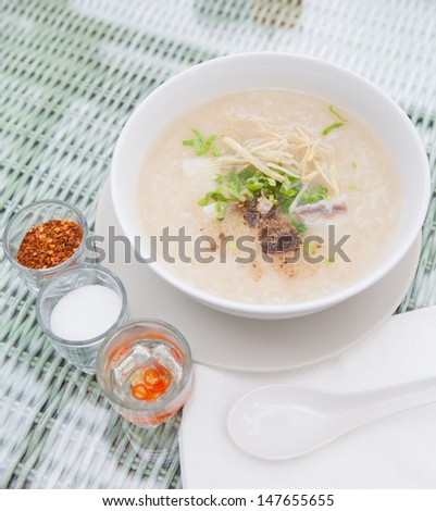 Traditional porridge rice gruel in bowl , Porridge for breakfast menu
