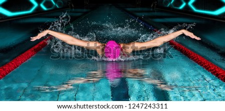 Professional woman in swimming pool. Butterfly  swimming style
