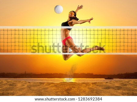 Female volley ball beach player in action