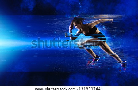 Woman sprinter leaving starting. Exploding start
