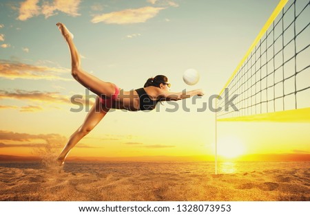 Female volley ball beach player in action