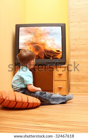 Little boy watching cinema on TV. TV screen - photo of the author