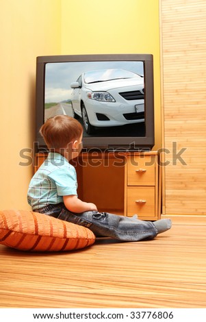 Little boy watching cinema on TV. TV screen - photo of the author