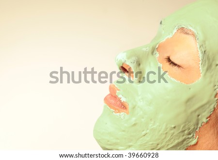 Woman in a health spa wearing a facial mask