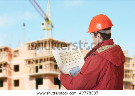 Project  architect checking blueprints of a new building