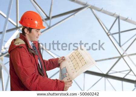 Project architect checking blueprints of a new building